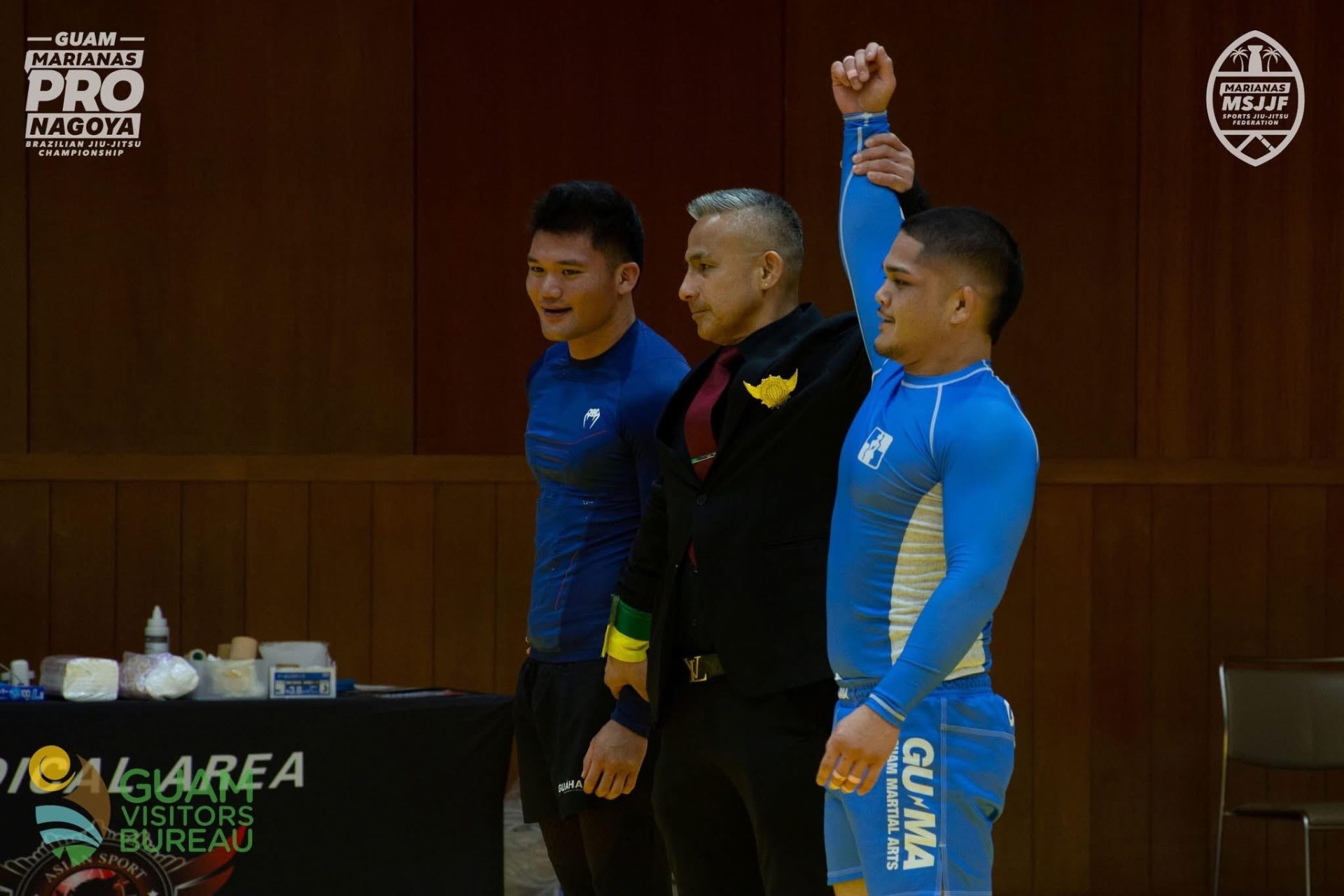 Coach Gabe having his hand raised at the Nagoya Pro Open