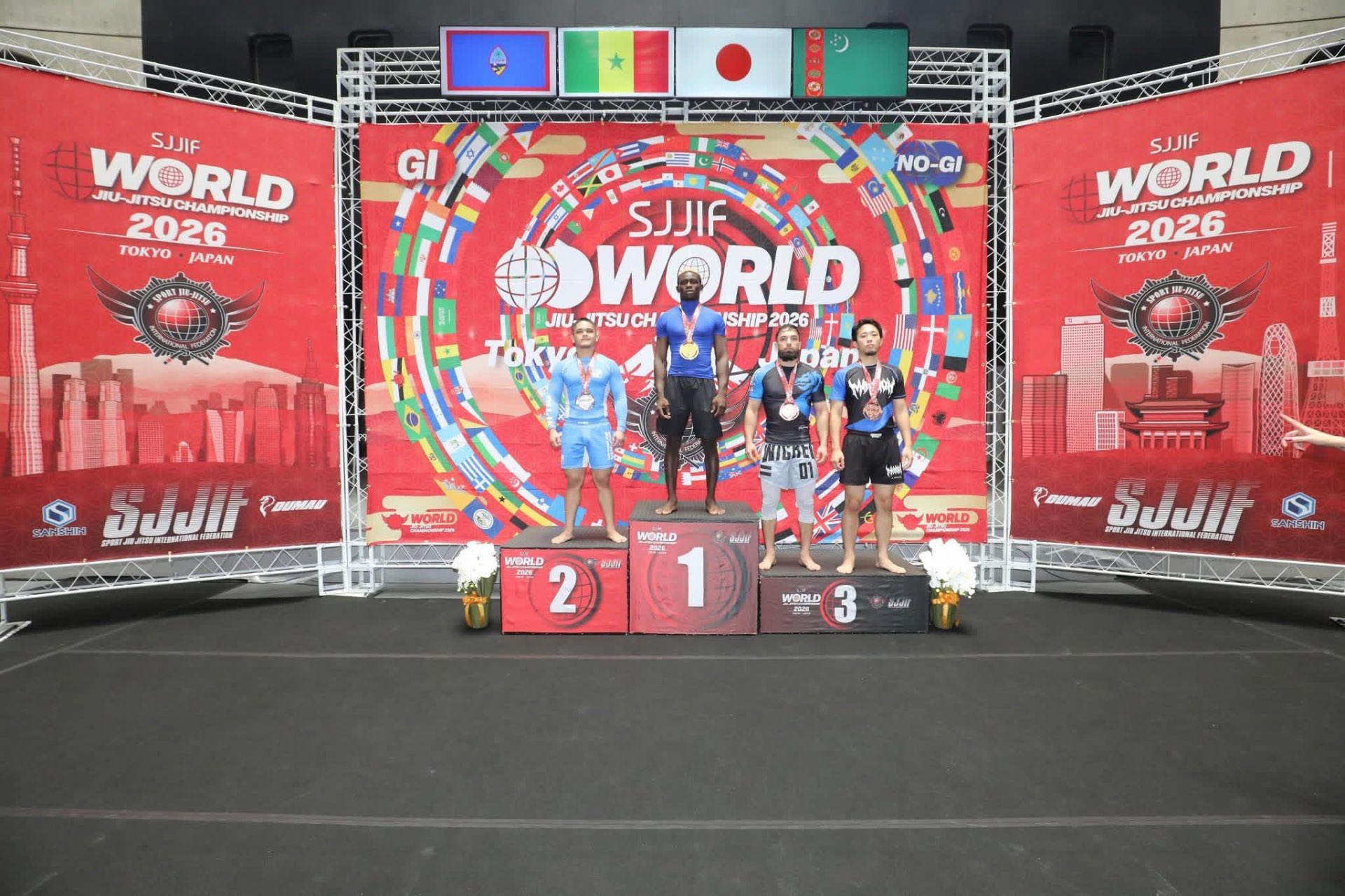 Coach Gabe on the SJJIF World Championship podium