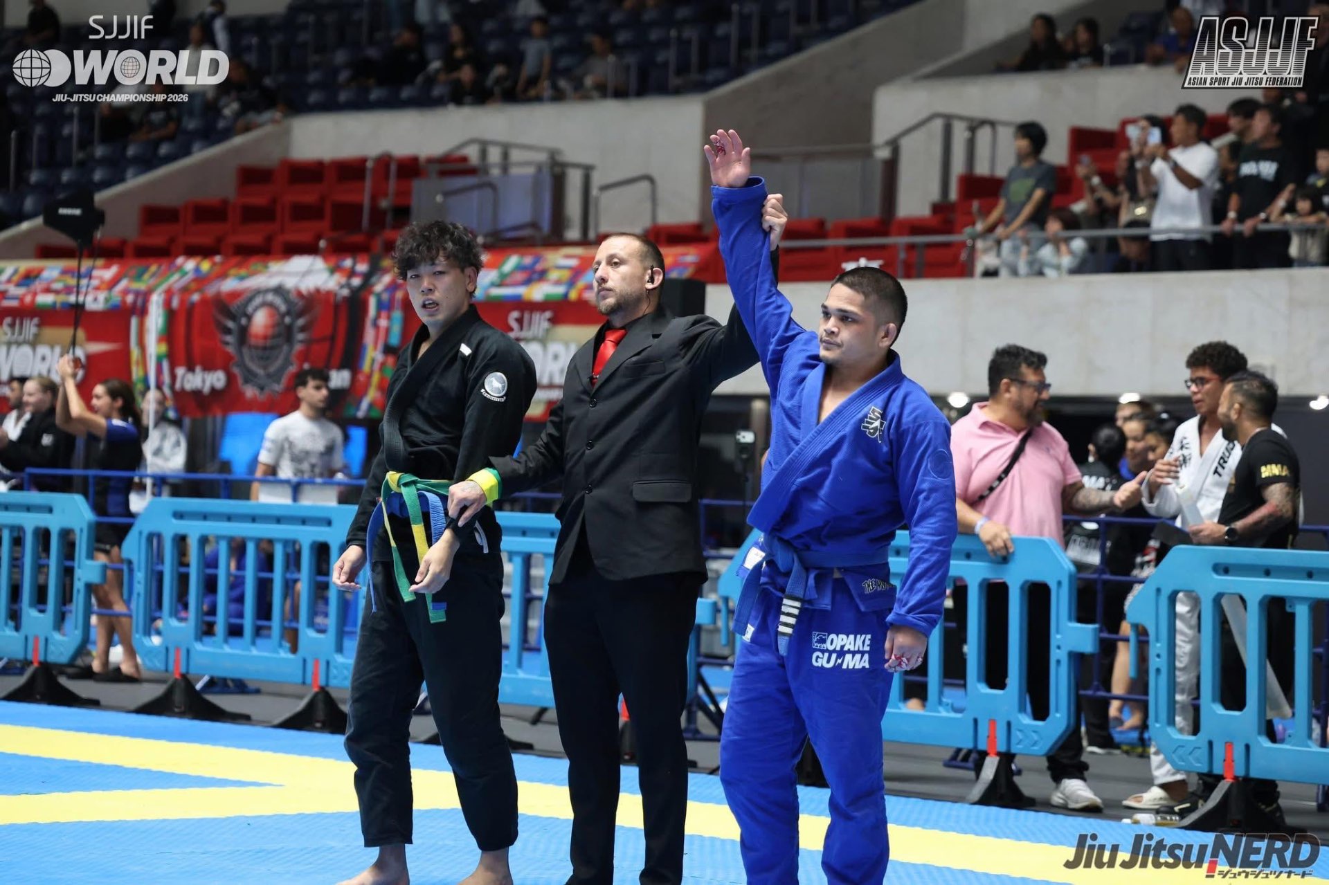 Coach Gabe having his hand raised at the SJJIF World Championship