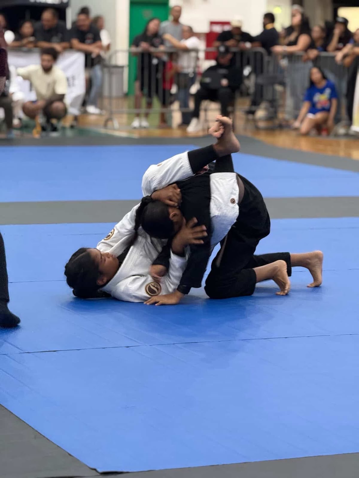 A’myah Cabe competing on the blue mats