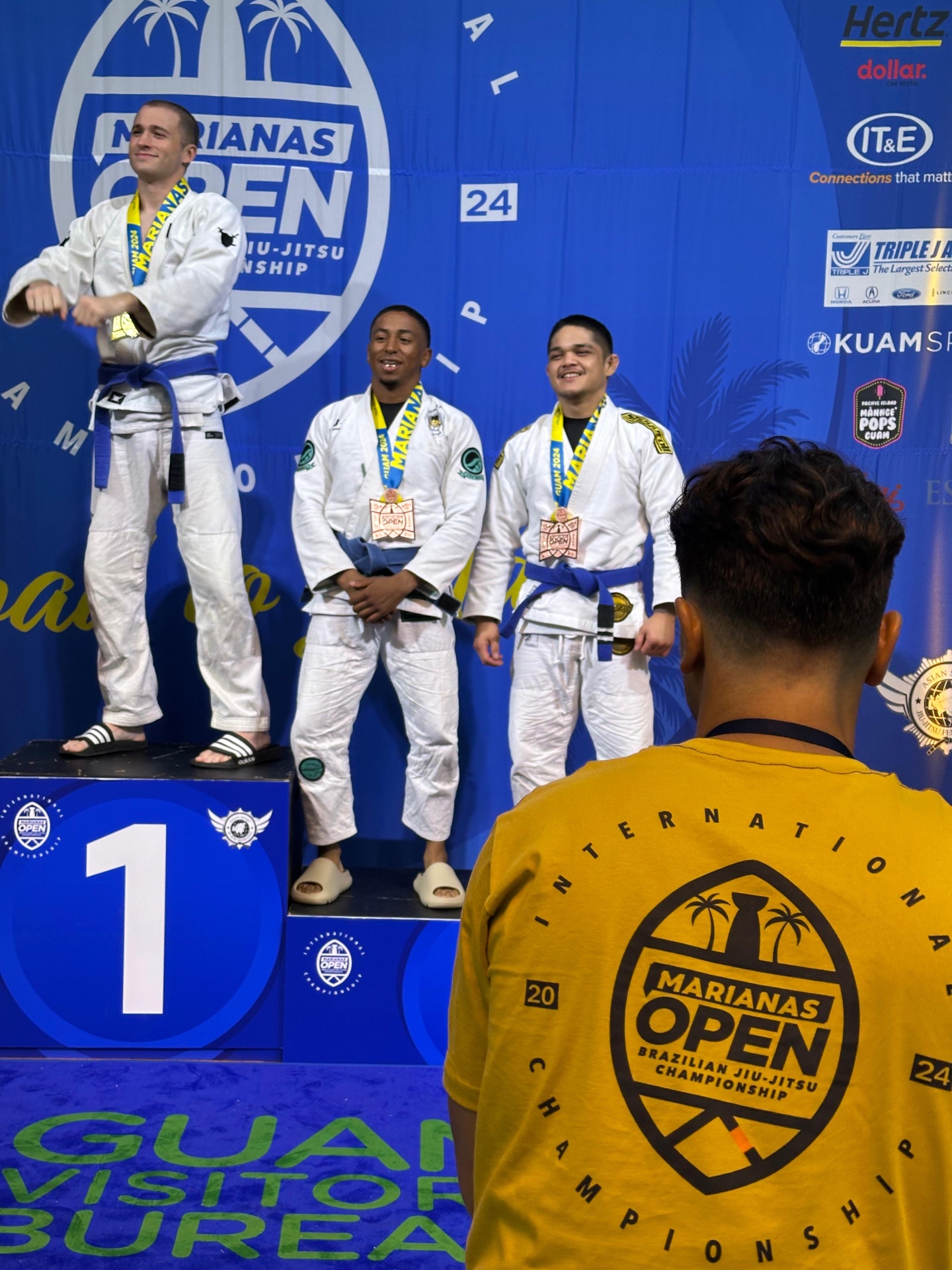 Coach Gabe on the podium at the 2024 Marianas Open