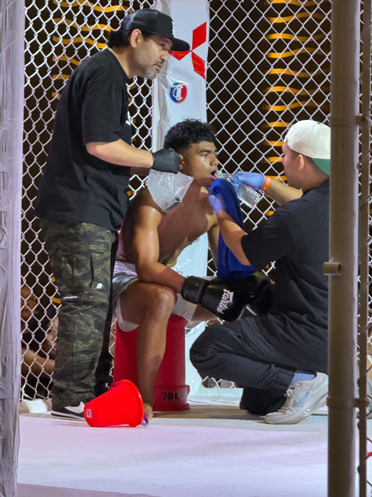 Jasper Alpet with his corner during an MMA bout