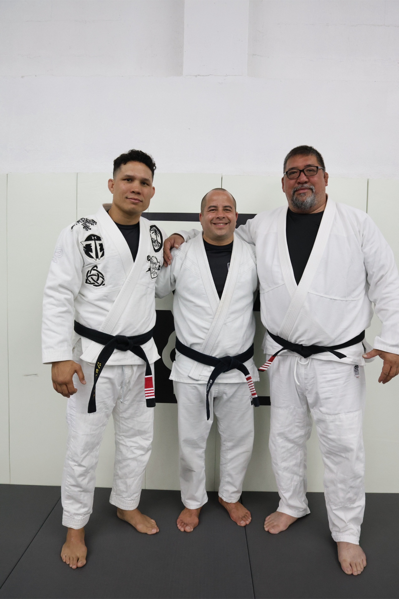 Sensei John Calvo with Sensei Jon Tuck and a teammate at GUMA