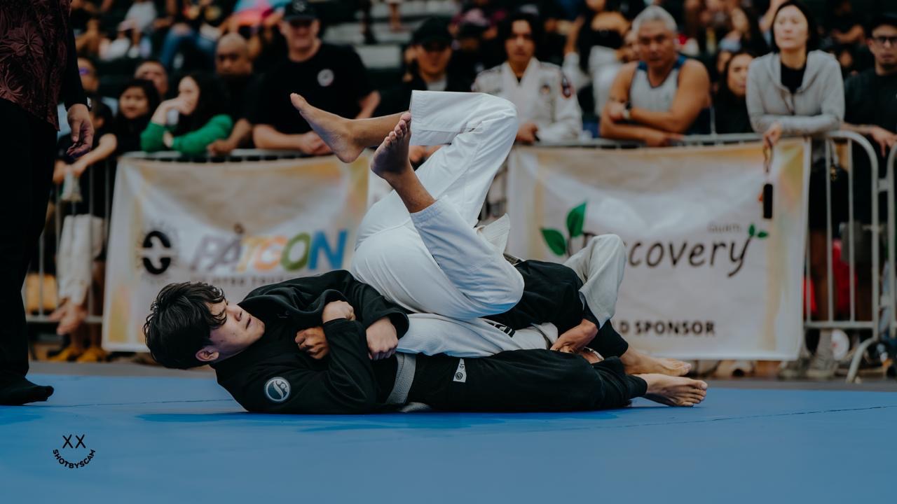 Ezra Okada in action at a Jiu Jitsu tournament
