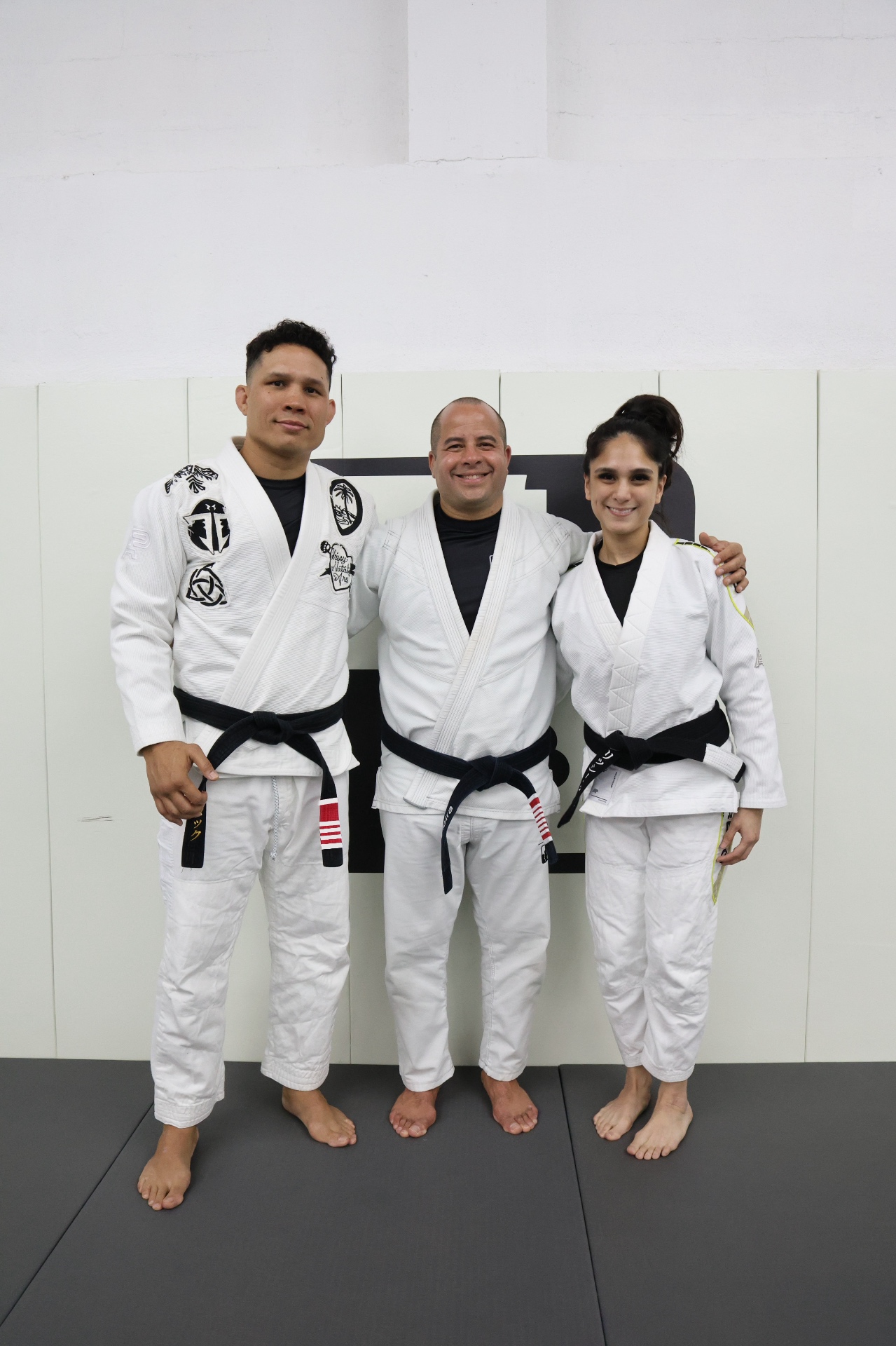 Sensei Jon Tuck with Professor Chrissy and a teammate at GUMA