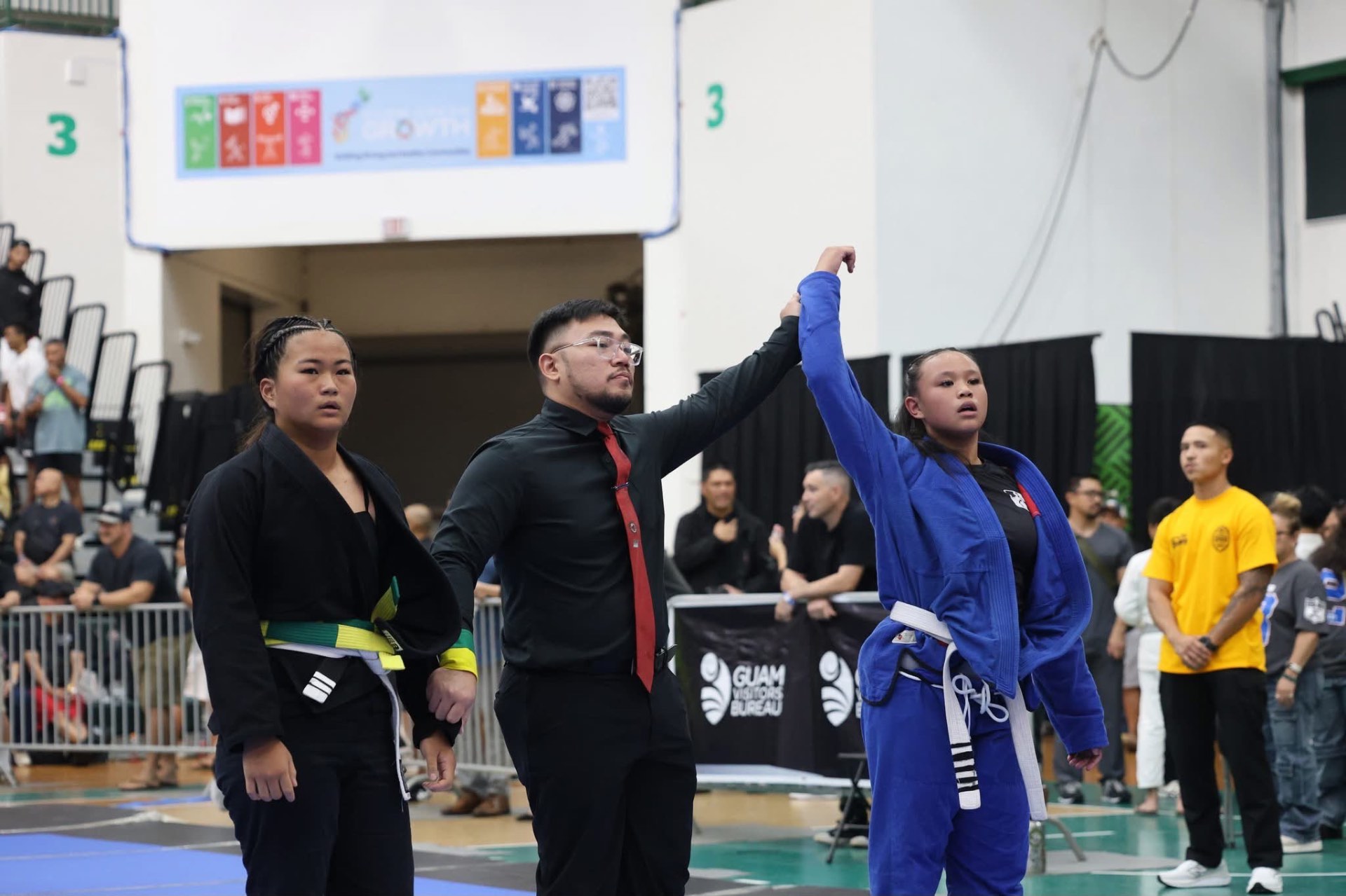 Sophia Miranda having her hand raised after a match