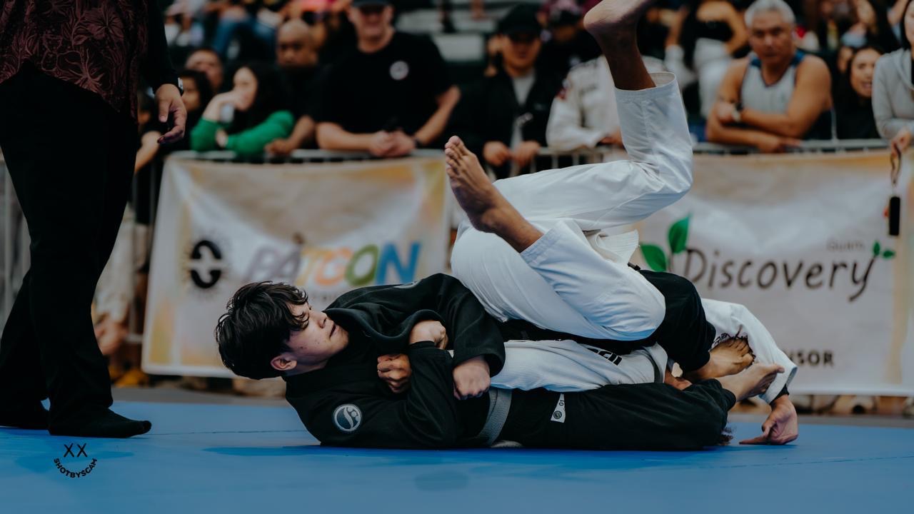 Ezra Okada competing on the mats