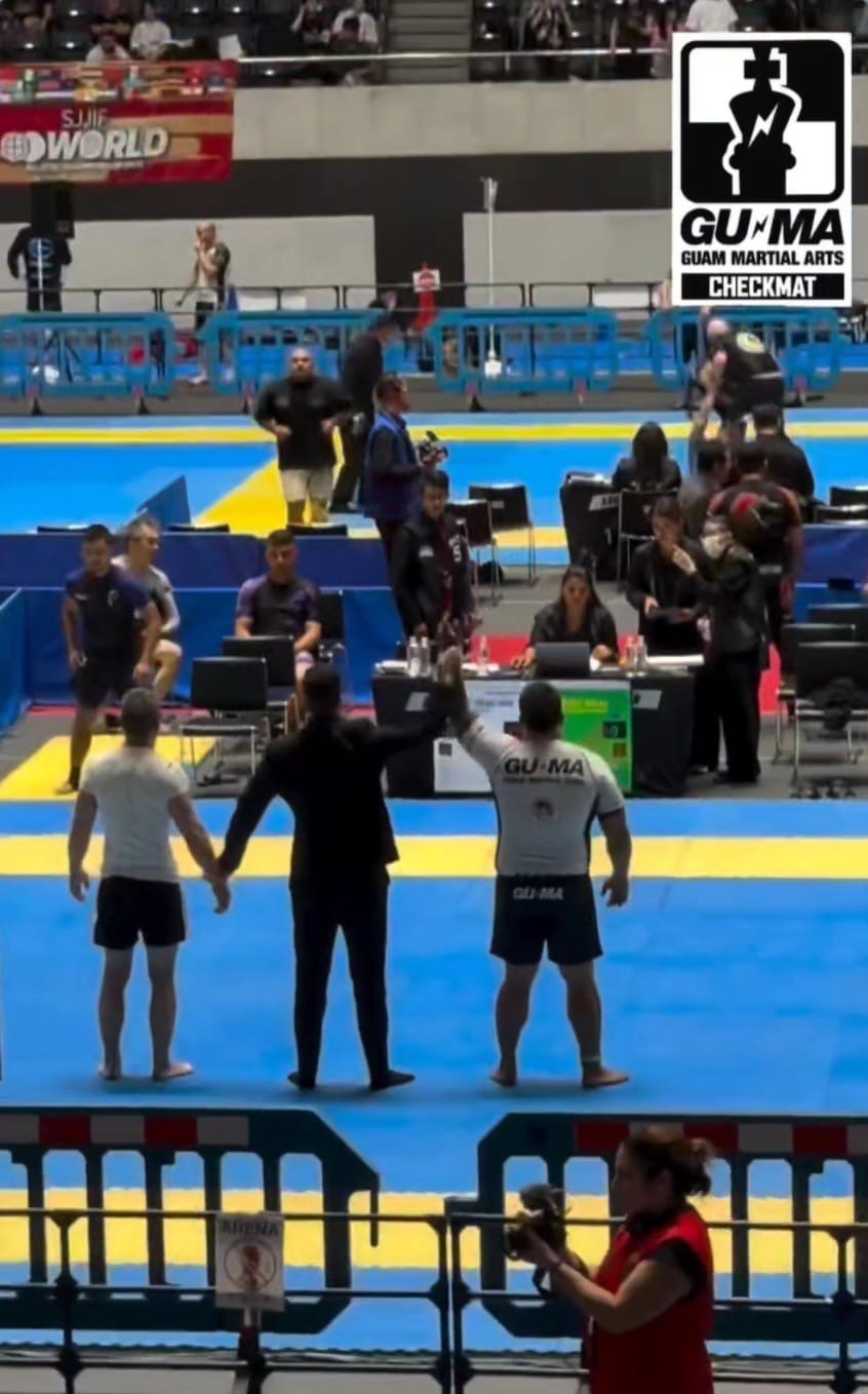 Travis John Salas getting his hand raised at the SJJIF World Championships