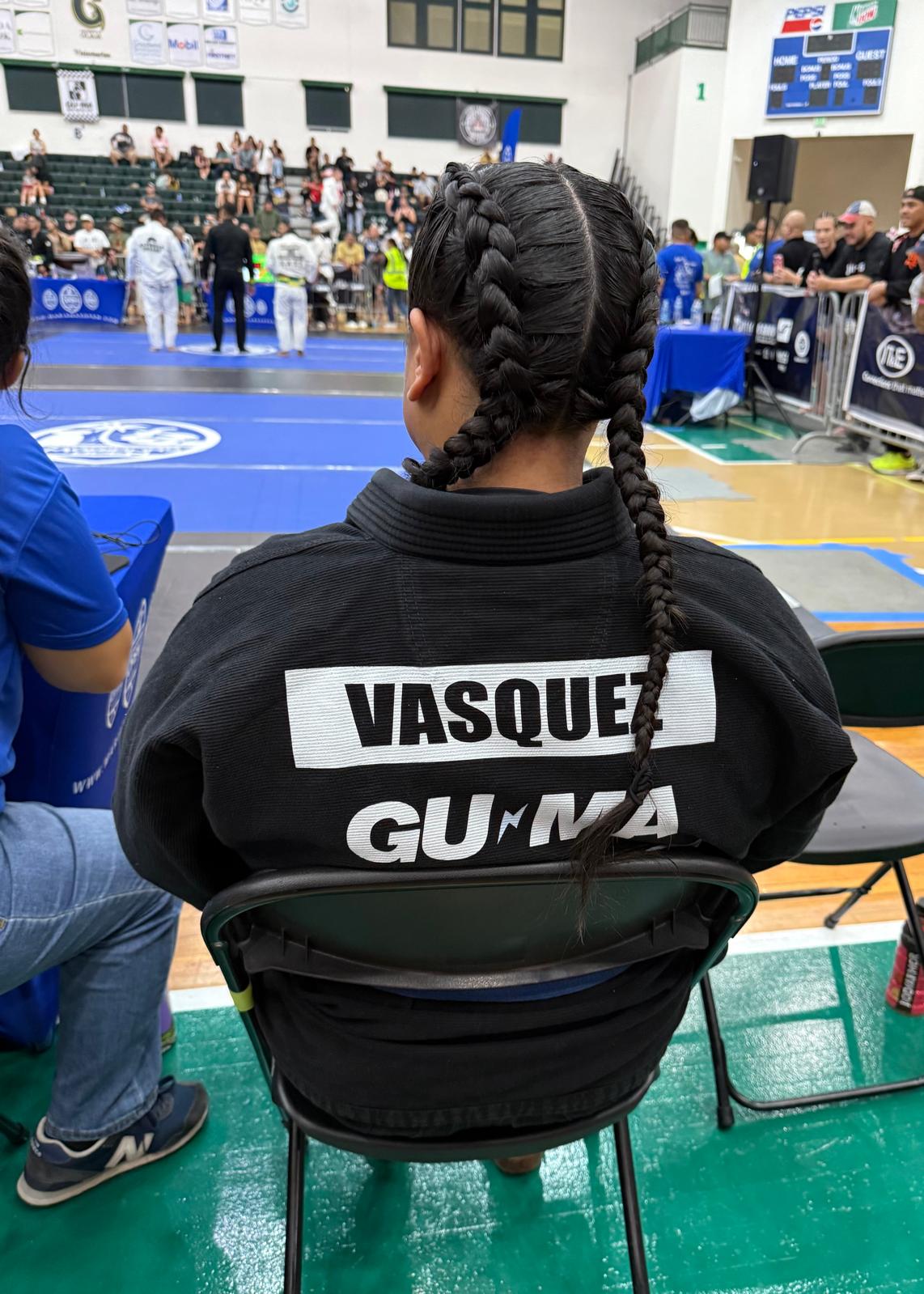 Desireé Vasquez representing GUMA from behind the mats