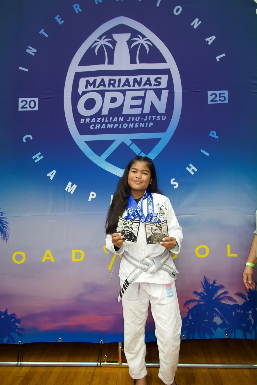 A’myah Cabe on the podium at Marianas Open with her medals